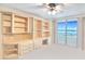 Bright bedroom includes built-in shelving and a private balcony at 2545 S Atlantic Ave # 2107-2108, Daytona Beach Shores, FL 32118
