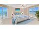 Cozy bedroom bathed in natural light with ocean views from the balcony and windows at 2545 S Atlantic Ave # 2107-2108, Daytona Beach Shores, FL 32118