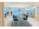 Stylish dining room with ocean views, chandelier lighting, and a formal dining set at 2545 S Atlantic Ave # 2107-2108, Daytona Beach Shores, FL 32118