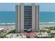 Oceanfront condominium building with balconies, offering stunning views and luxurious living at 2545 S Atlantic Ave # 2107-2108, Daytona Beach Shores, FL 32118