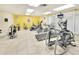 The property features a gym room with various exercise machines and tile floors at 2545 S Atlantic Ave # 2107-2108, Daytona Beach Shores, FL 32118