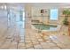 Relax in this modern hot tub located in a clean, tiled spa area with natural light at 2545 S Atlantic Ave # 2107-2108, Daytona Beach Shores, FL 32118