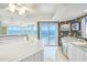 Bright kitchen showcasing a large island, stainless steel appliances, and picturesque ocean views at 2545 S Atlantic Ave # 2107-2108, Daytona Beach Shores, FL 32118