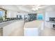 Well-equipped kitchen boasting white cabinetry, an island, and ocean views at 2545 S Atlantic Ave # 2107-2108, Daytona Beach Shores, FL 32118