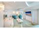 Bright living room with modern lighting, stylish furniture, and expansive windows overlooking the water at 2545 S Atlantic Ave # 2107-2108, Daytona Beach Shores, FL 32118