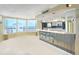 Open-concept living room with floor-to-ceiling windows offering expansive water views at 2545 S Atlantic Ave # 2107-2108, Daytona Beach Shores, FL 32118