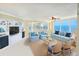 Cozy living room with ocean views, comfortable seating, and built-in shelving at 2545 S Atlantic Ave # 2107-2108, Daytona Beach Shores, FL 32118