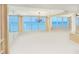Large open living room with large windows showcasing breathtaking ocean views at 2545 S Atlantic Ave # 2107-2108, Daytona Beach Shores, FL 32118