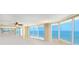Bright living room with floor-to-ceiling windows showcasing ocean views and a private balcony at 2545 S Atlantic Ave # 2107-2108, Daytona Beach Shores, FL 32118