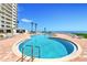 Beautifully designed outdoor swimming pool with brick surround and ocean views from a beachside condominium at 2545 S Atlantic Ave # 2107-2108, Daytona Beach Shores, FL 32118