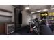 Well-equipped home gym with exercise bike and treadmill at 10262 Chiltern Garden Dr, Orlando, FL 32827