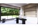 Modern home office features built-in shelving and backyard view at 10262 Chiltern Garden Dr, Orlando, FL 32827