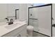 Modern bathroom with a glass-enclosed shower, black hardware, and a white vanity at 231 Severn Way # 36, Orlando, FL 32803