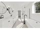 Beautiful bathroom with double sinks, soaker tub, and separate glass enclosed shower at 231 Severn Way # 36, Orlando, FL 32803