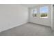 Comfortable bedroom with neutral carpet, natural light and a closet for storage at 231 Severn Way # 36, Orlando, FL 32803