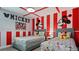 Themed ' bedroom featuring two twin beds with cartoon decor and vibrant colors at 2726 Oxymoron Way, Kissimmee, FL 34746