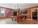Marvel-themed game room with pool table, Captain America decor and large tv screen at 2726 Oxymoron Way, Kissimmee, FL 34746
