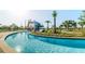 Community Waterpark featuring waterslides, a lazy river, and lush landscaping at 2726 Oxymoron Way, Kissimmee, FL 34746