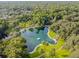 Aerial view of a natural spring with a sandy beach at 213 Crown Oaks Way # 213, Longwood, FL 32779