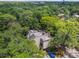 Aerial view of a condo nestled in lush greenery, showcasing its unique architectural design and private surroundings at 213 Crown Oaks Way # 213, Longwood, FL 32779