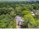 Aerial view of a condo nestled in lush greenery, showcasing its unique architectural design and private surroundings at 213 Crown Oaks Way # 213, Longwood, FL 32779