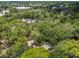 Elevated view showcasing the home's secluded setting amongst abundant trees at 213 Crown Oaks Way # 213, Longwood, FL 32779