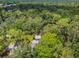 Elevated view of home nestled in a lush, wooded area at 213 Crown Oaks Way # 213, Longwood, FL 32779