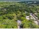 Aerial view of community, lush trees, and homes at 213 Crown Oaks Way # 213, Longwood, FL 32779