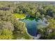 Aerial view of a natural spring and surrounding park at 213 Crown Oaks Way # 213, Longwood, FL 32779