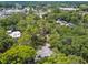 Elevated view showcasing the home's secluded setting amongst abundant trees at 213 Crown Oaks Way # 213, Longwood, FL 32779