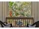 Private balcony overlooking lush greenery at 213 Crown Oaks Way # 213, Longwood, FL 32779