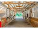 Long row of barn stalls with horses and ceiling fans at 213 Crown Oaks Way # 213, Longwood, FL 32779