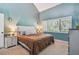 Main bedroom with vaulted ceilings and window at 213 Crown Oaks Way # 213, Longwood, FL 32779