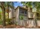 Building exterior with balcony and trees at 213 Crown Oaks Way # 213, Longwood, FL 32779