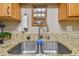 Kitchen sink with granite countertop and modern faucet at 213 Crown Oaks Way # 213, Longwood, FL 32779