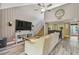 Vaulted ceilings and wood wall paneling highlight this living room at 213 Crown Oaks Way # 213, Longwood, FL 32779