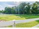 Grass paddock with white post and rail fencing at 213 Crown Oaks Way # 213, Longwood, FL 32779