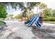 Community playground with slides and play area at 213 Crown Oaks Way # 213, Longwood, FL 32779