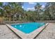 Community pool with surrounding palm trees and patio area at 213 Crown Oaks Way # 213, Longwood, FL 32779