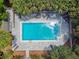 Inviting community pool with ample deck space for lounging and relaxation at 213 Crown Oaks Way # 213, Longwood, FL 32779