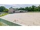 Spacious sand riding arena with white post and rail fencing at 213 Crown Oaks Way # 213, Longwood, FL 32779