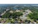 Aerial view of community near a lake and main road at 128 Lake Dr, Oviedo, FL 32765