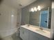 Modern bathroom with double vanity and bathtub at 128 Lake Dr, Oviedo, FL 32765