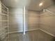 Spacious walk-in closet with ample shelving at 128 Lake Dr, Oviedo, FL 32765