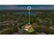 Aerial view of a house in a residential neighborhood near a lake at 2107 Westover Reserve Blvd, Windermere, FL 34786