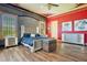 Elegant main bedroom with a plush bed and red accent wall at 2107 Westover Reserve Blvd, Windermere, FL 34786