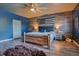 Bedroom with wood flooring, American flag wall and king bed at 2107 Westover Reserve Blvd, Windermere, FL 34786