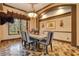 Bright dining room with large windows, chandelier, and decorative tile floor at 2107 Westover Reserve Blvd, Windermere, FL 34786