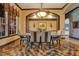 Formal dining room featuring a large table, chandelier, and decorative tile floor at 2107 Westover Reserve Blvd, Windermere, FL 34786