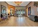 Elegant entryway with hardwood floors, chandelier, and artwork at 2107 Westover Reserve Blvd, Windermere, FL 34786